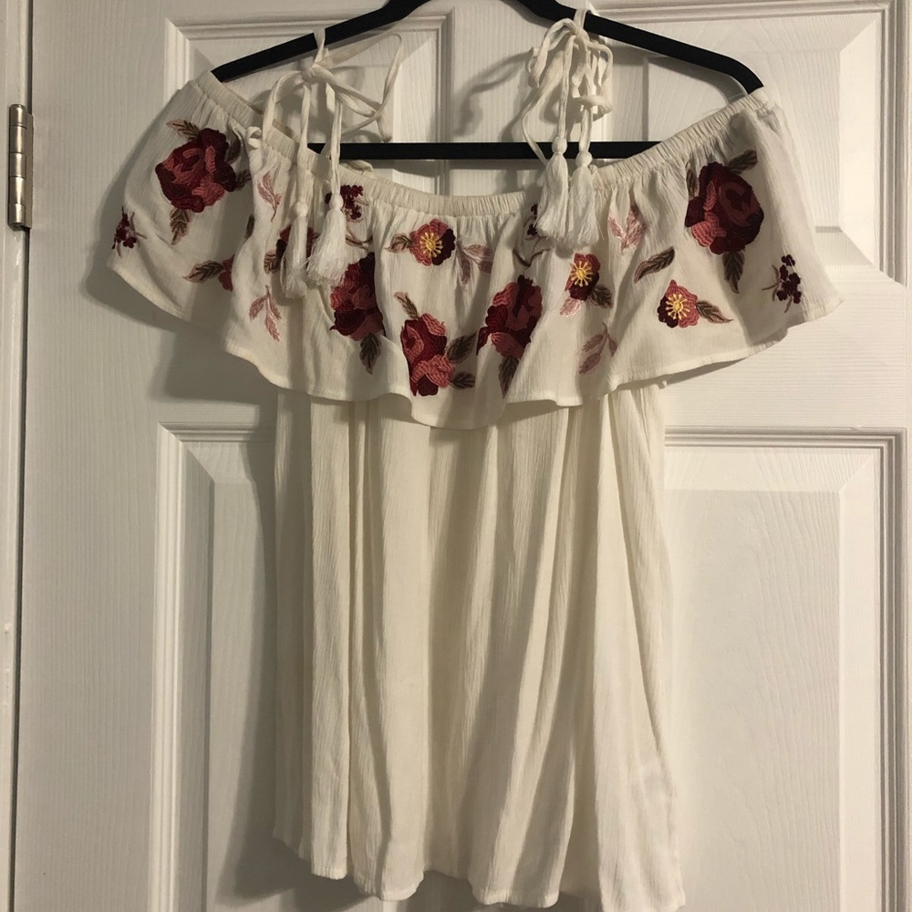 Francesca’s off-the-shoulder floral blouse